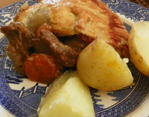 Goat pie served with new potatoes